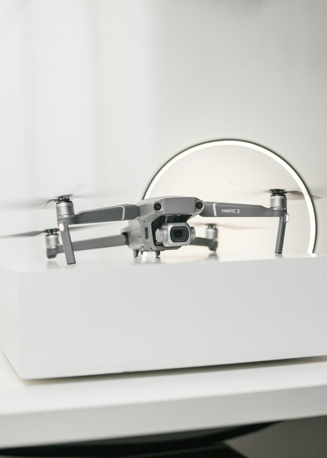black and gray corded headphones on white table