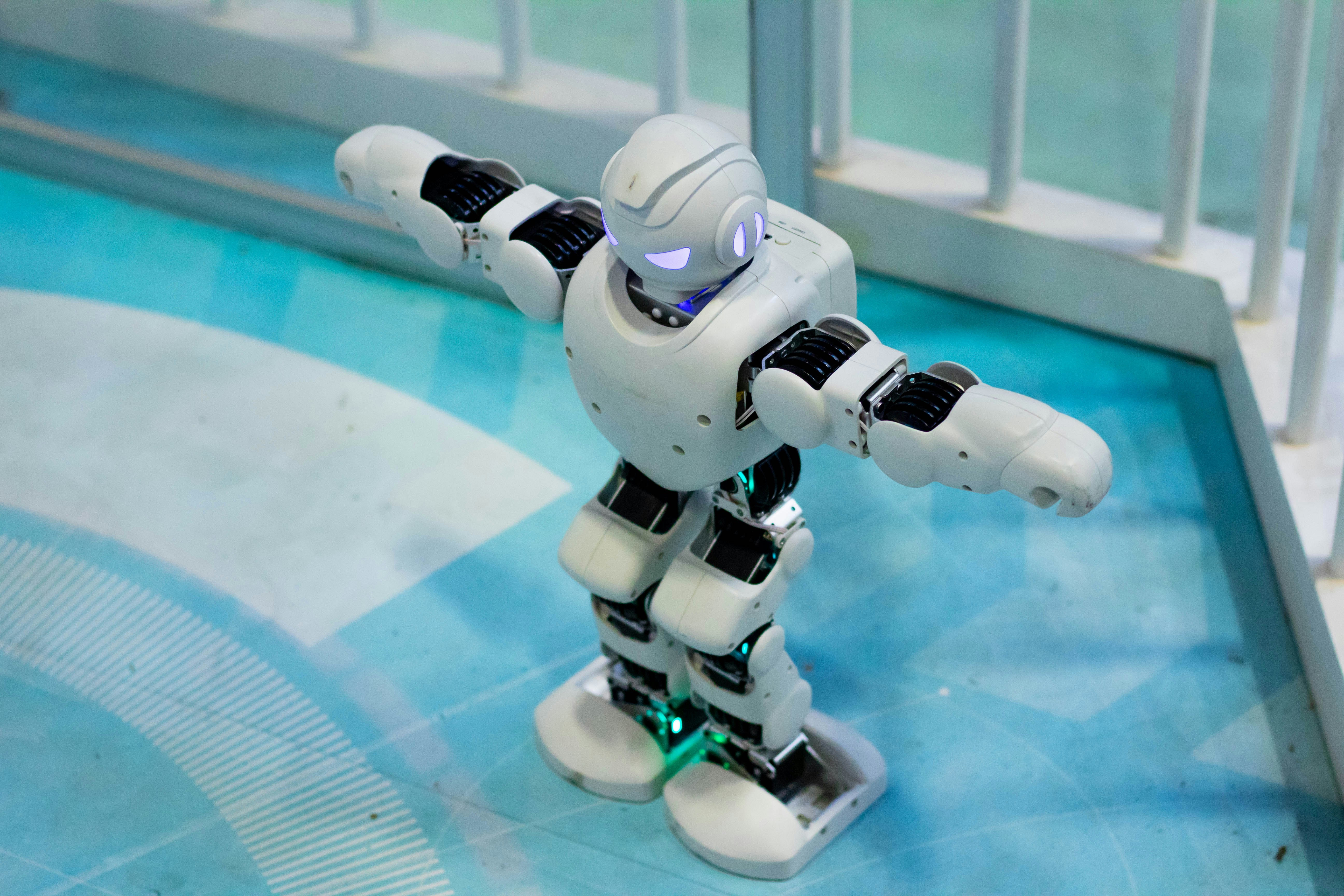 👋 Conclusion: Your Pool, Cleaner Than Ever with Robotic Precision! by Robot Instructions a toy robot standing on a blue floor